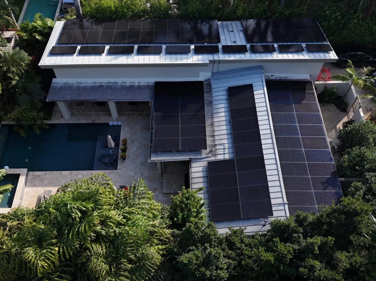 Aerial view of a South Florida home with a rooftop solar installation